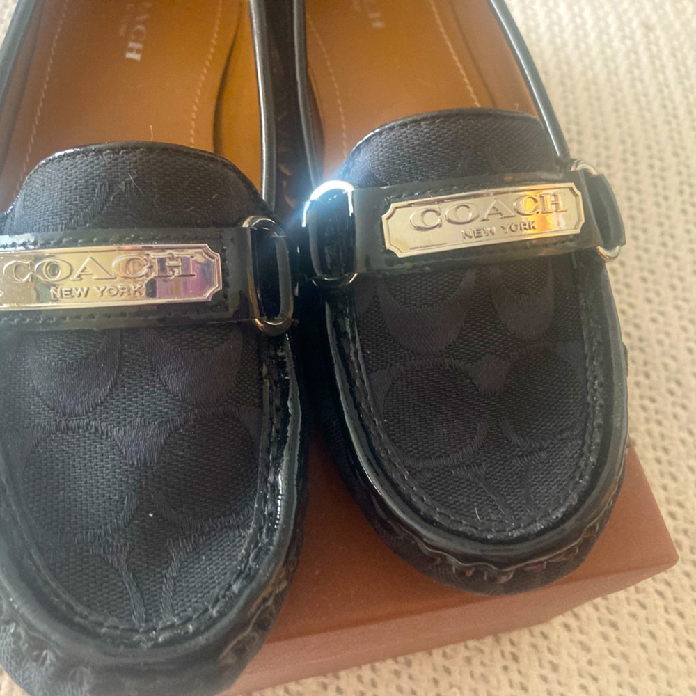 Coach Signature C design flat loafers.